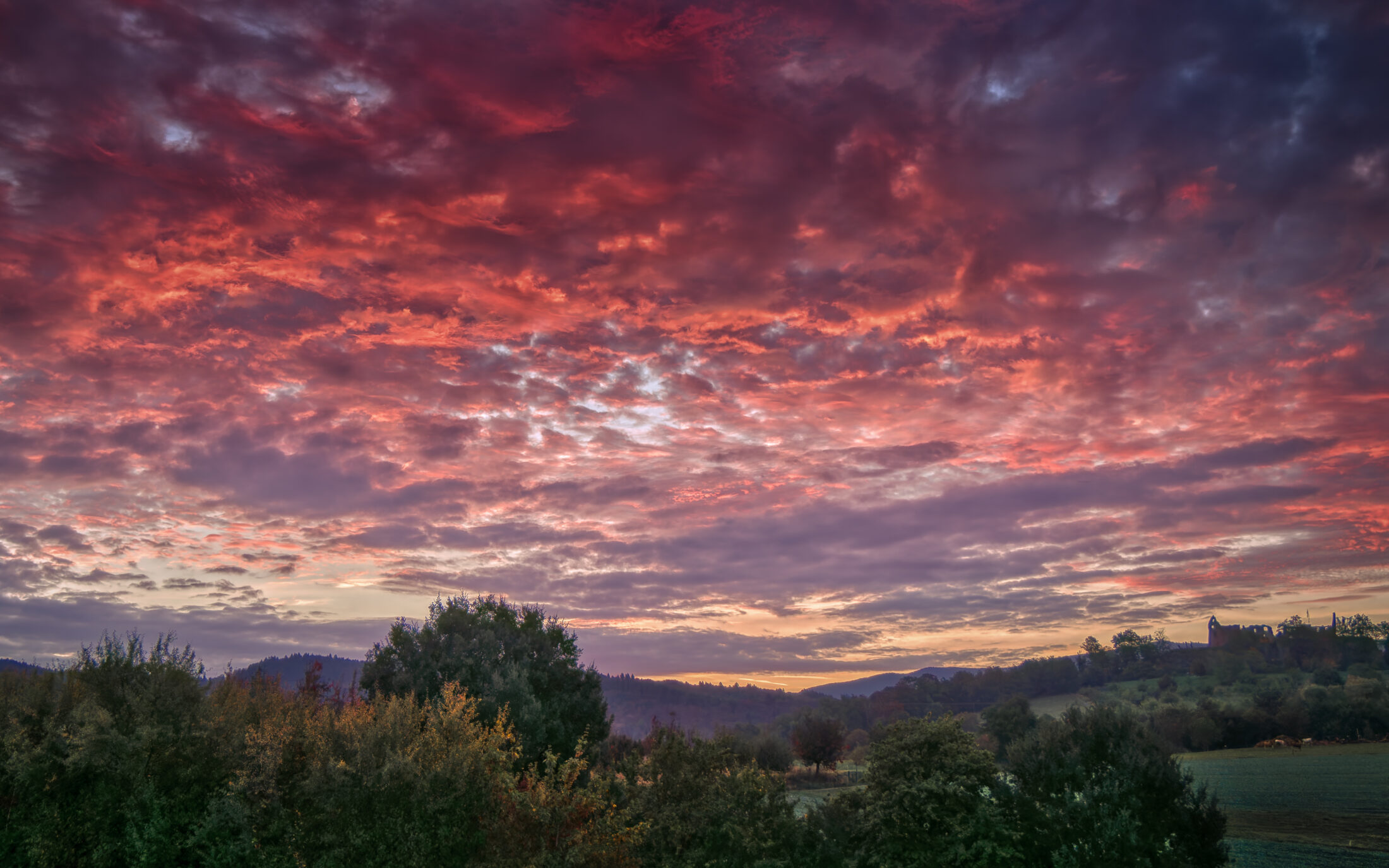 Fiery Sunrise over Hochburg Castle Ruins